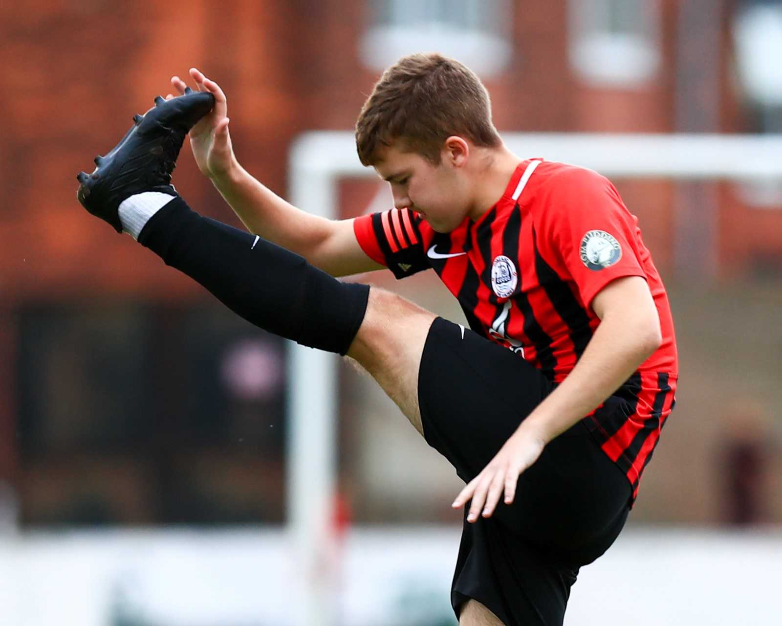 A footballer warming up